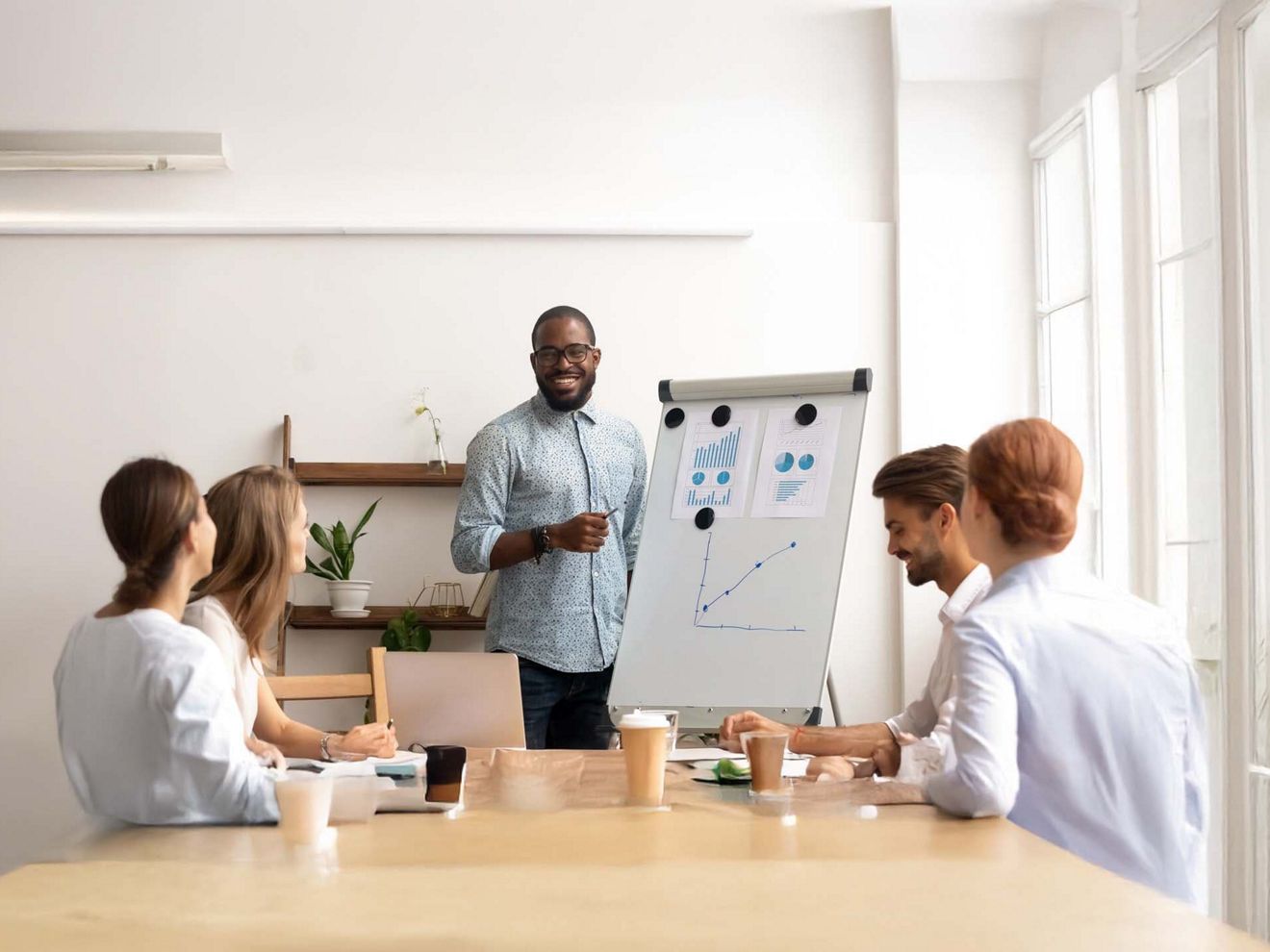 A business leader shares side-by-side network performance insights with their team.