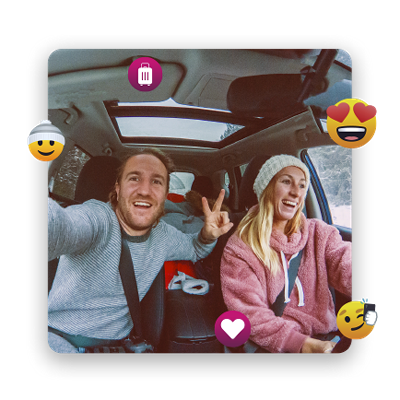 A couple takes a selfie while in a car.