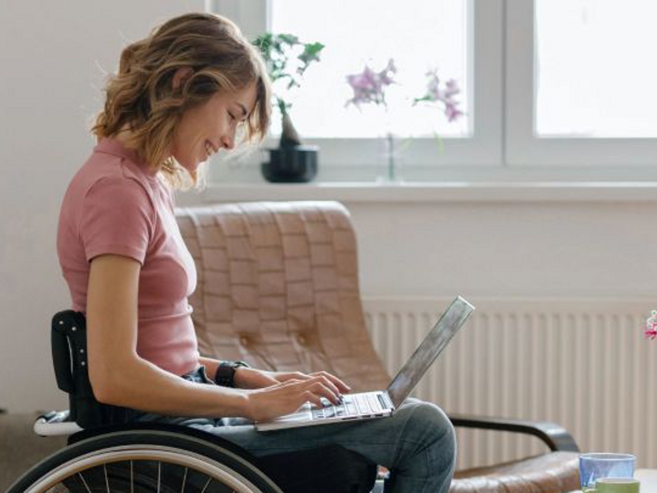 Woman typing on her laptop