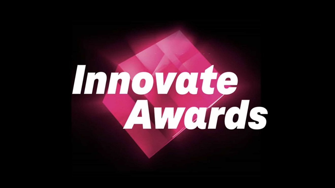 Innovate Awards text on top of a shining magenta cube.