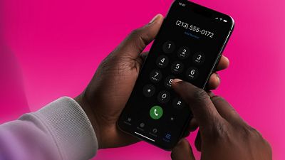 A person taps a smartphone dialer on a magenta background.