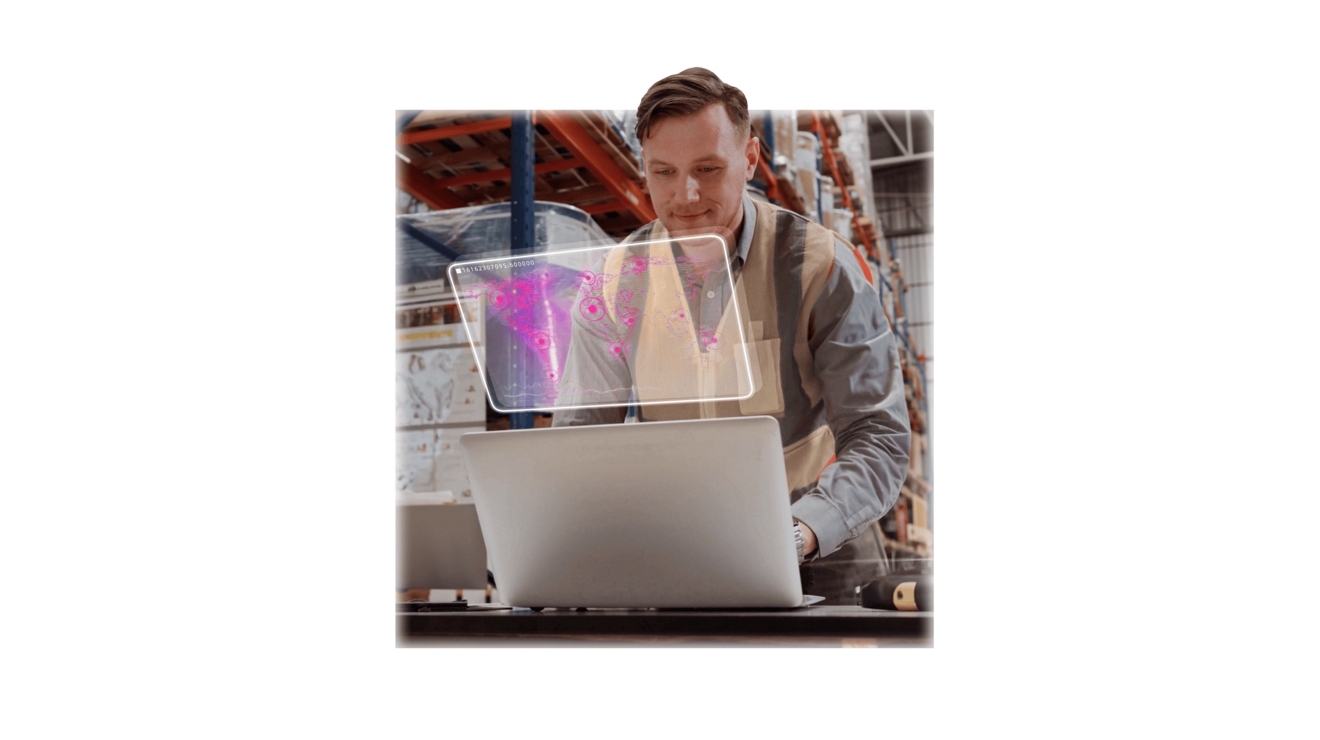 A warehouse employee reviews tracked locations on a world map from their laptop.