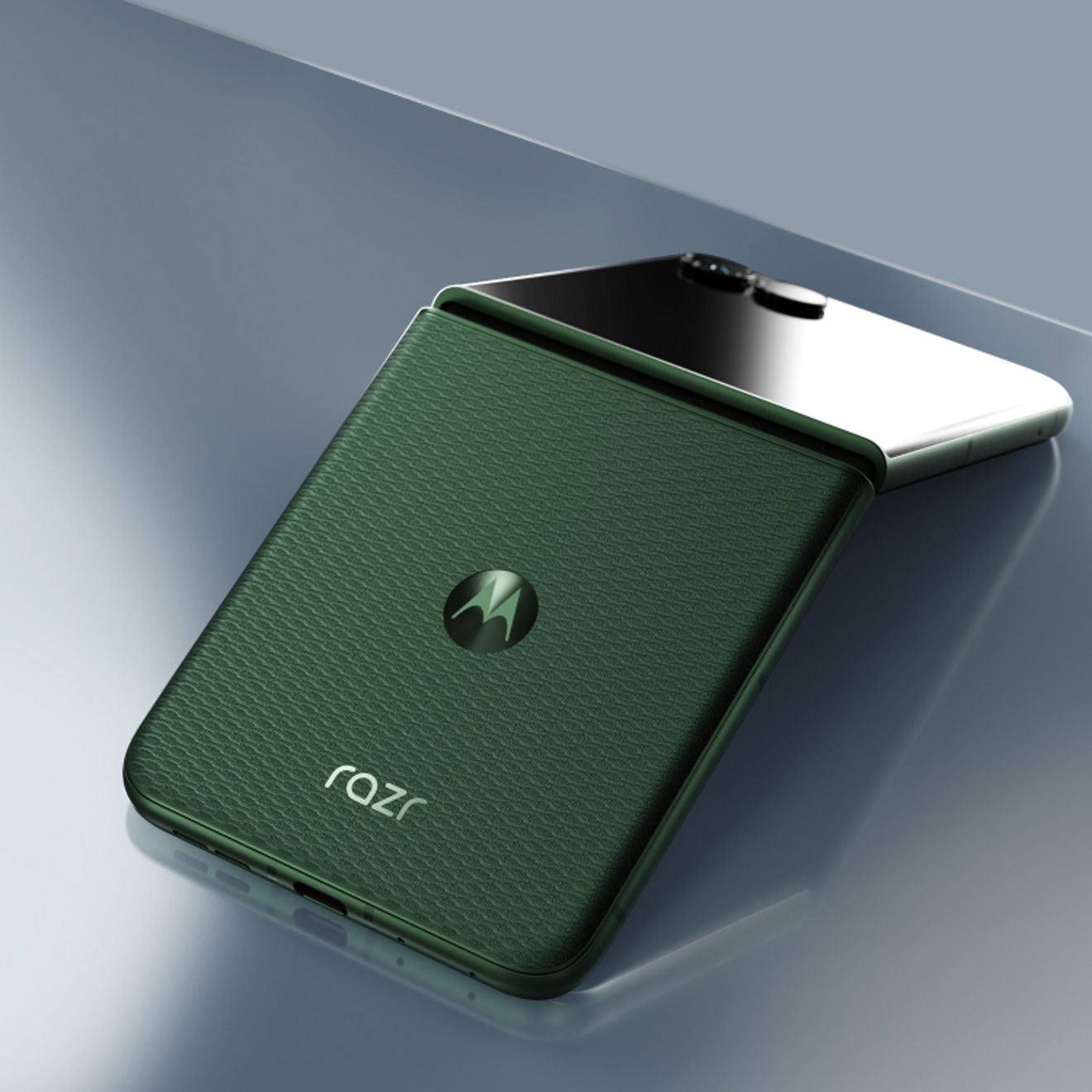motorola razr in PANTONE® Mountain View shown partially folded, highlighting its woven-inspired textured finish and compact flip design.