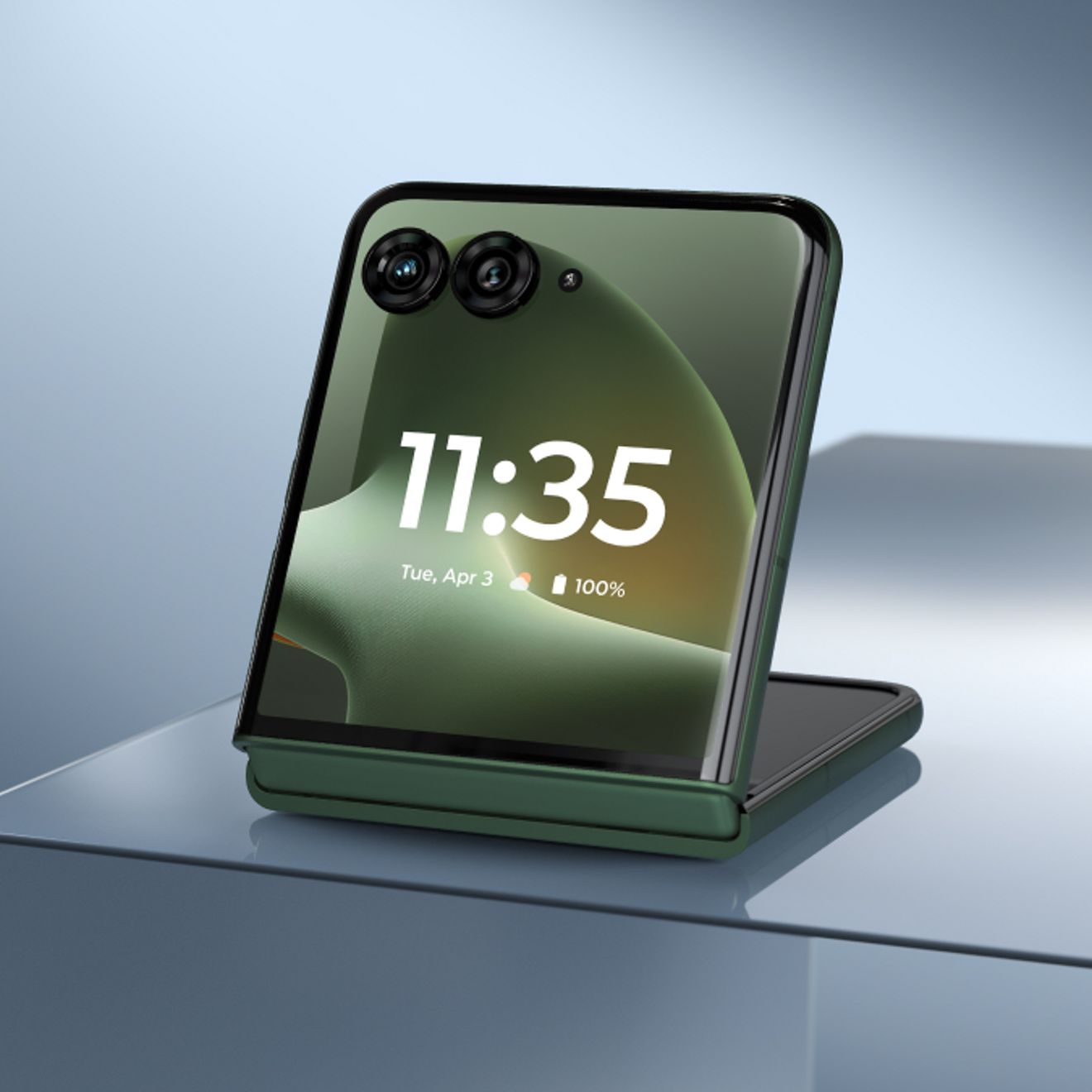 motorola razr flip phone in dark green partially folded in Flex View mode, displaying the time and dual rear cameras on the external screen.