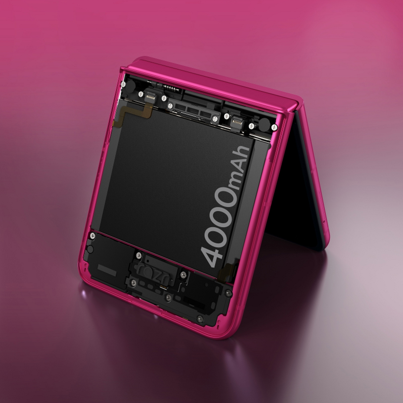 Motorola razr plus in the pink peacock finish, partially folded so it can stand on a table.