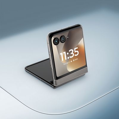Motorola razr in gray, shown partially folded with the outer display facing forward on a flat surface.