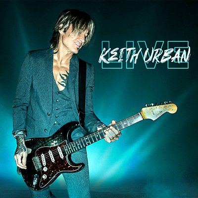 Keith Urban plays the electric guitar with blue light rays behind him.