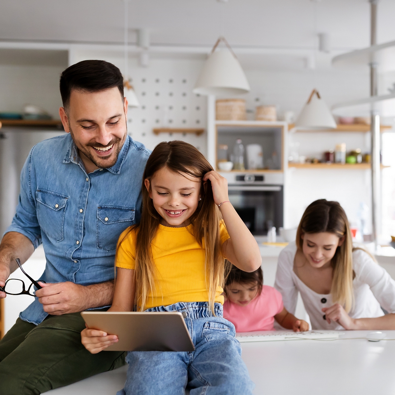 Family together working on a tablet