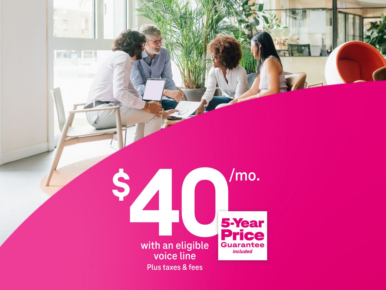 Colleagues working together around a table, using 5G Business Internet for $40 per month with eligible voice line plus taxes and fees, includes 5-year price guarantee.
