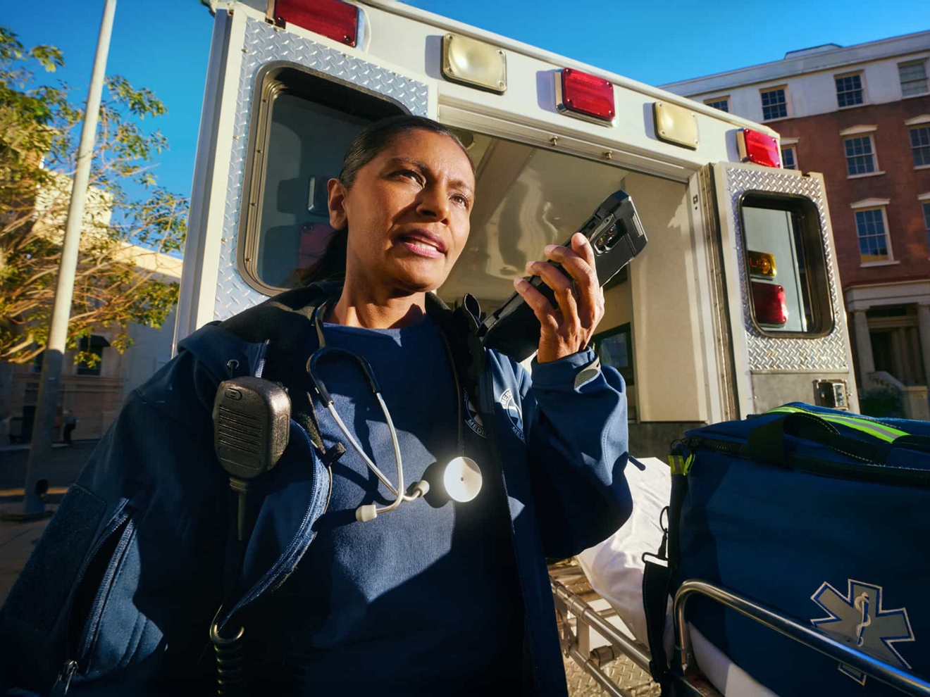 An EMT uses a device enabled with Push-to-Talk service.
