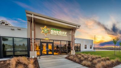 The Spokane County Sheriff’s Office Regional Training Center with a sunset behind it.