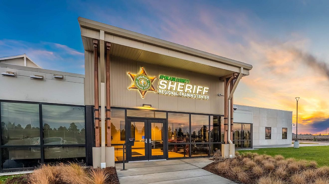 The Spokane County Sheriff Regional Training Center building at sunset.