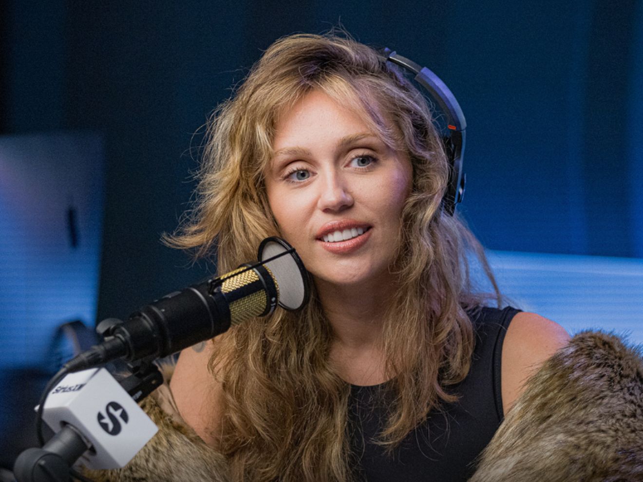 Woman speaking on podcast