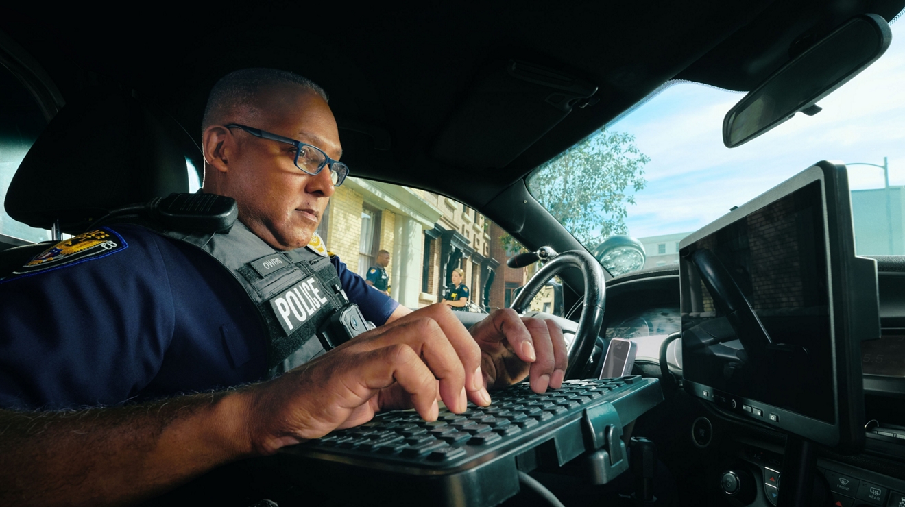 Officer on computer in car