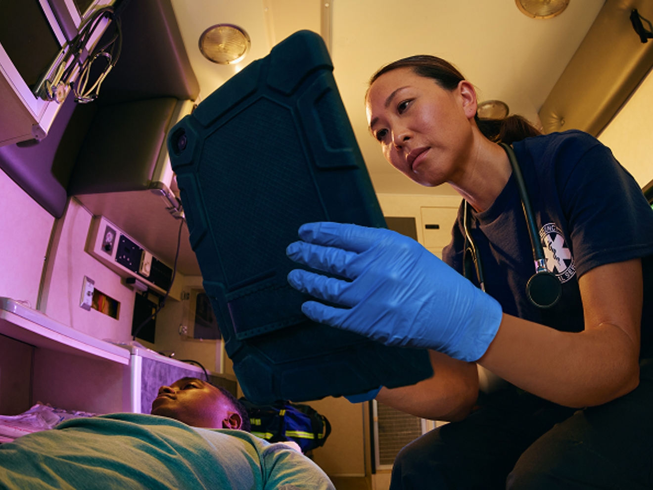 EMT on tablet in ambulence