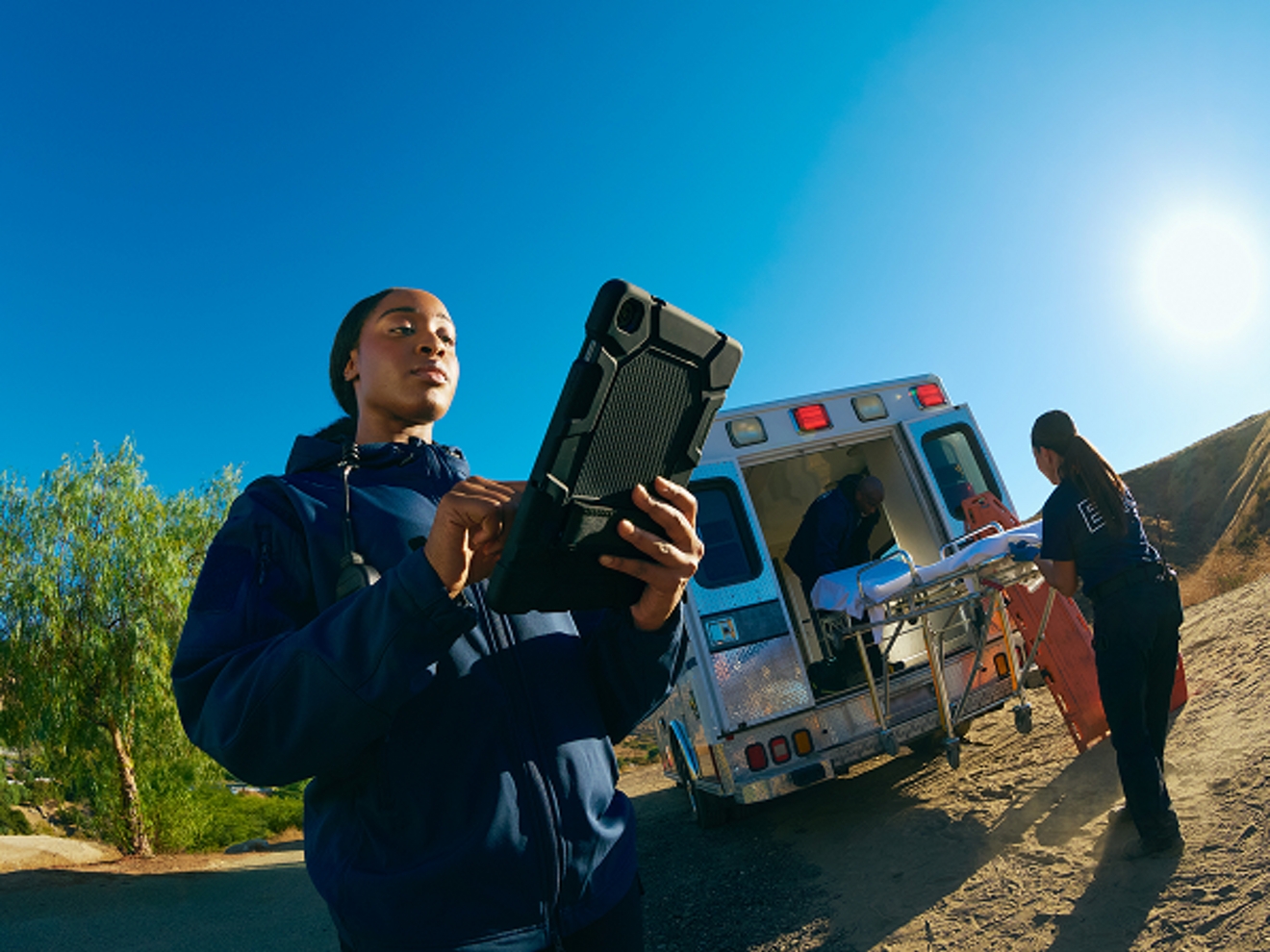 Two EMTs outside ambulance