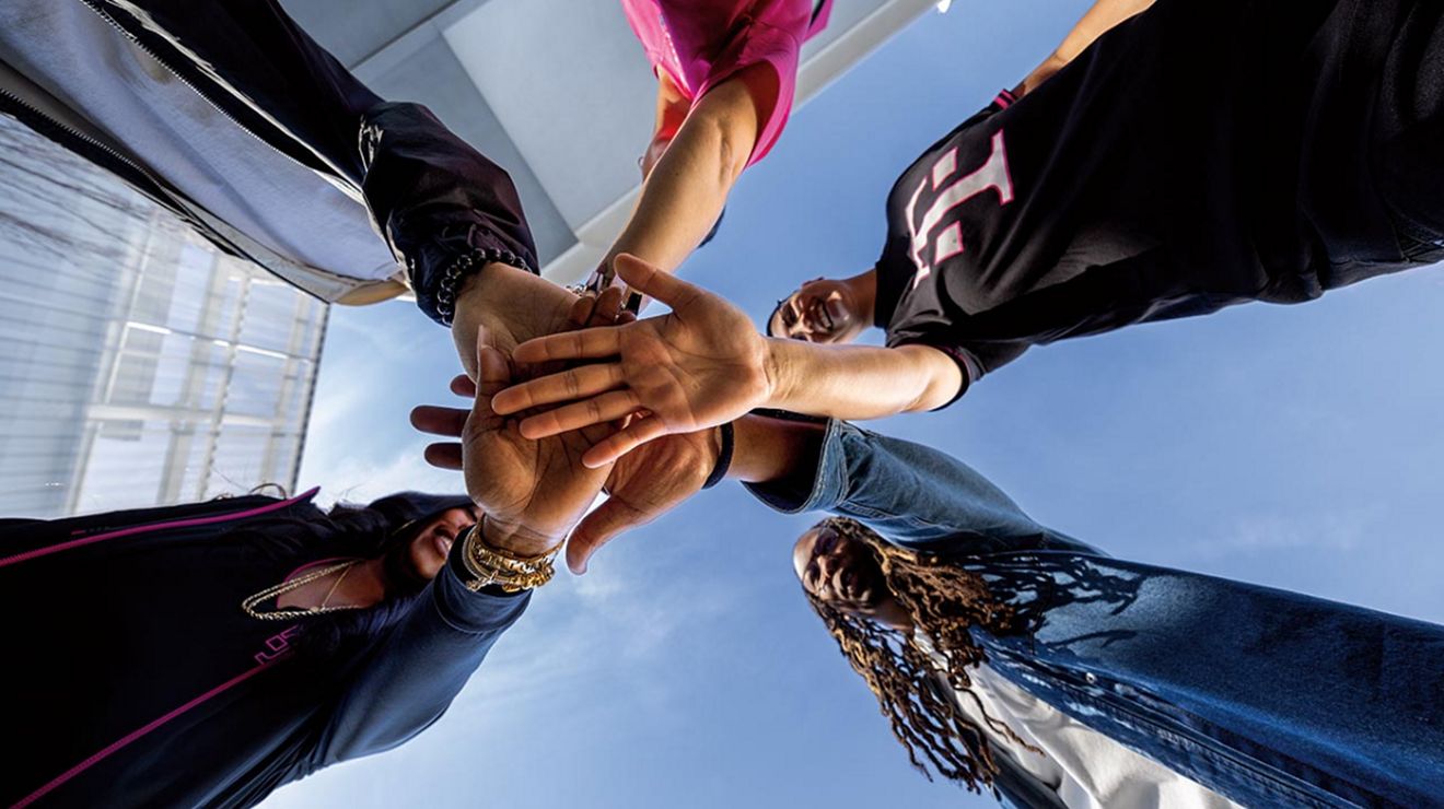 A T-Mobile dedicated team joining hands to support your business journey and success.