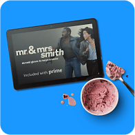 A tablet showing Amazon Prime exclusive content, next to a bowl of ice cream.