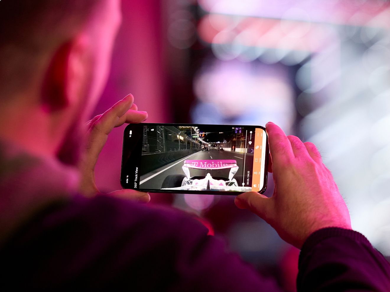 An F1 fan watching the race on their smartphone.
