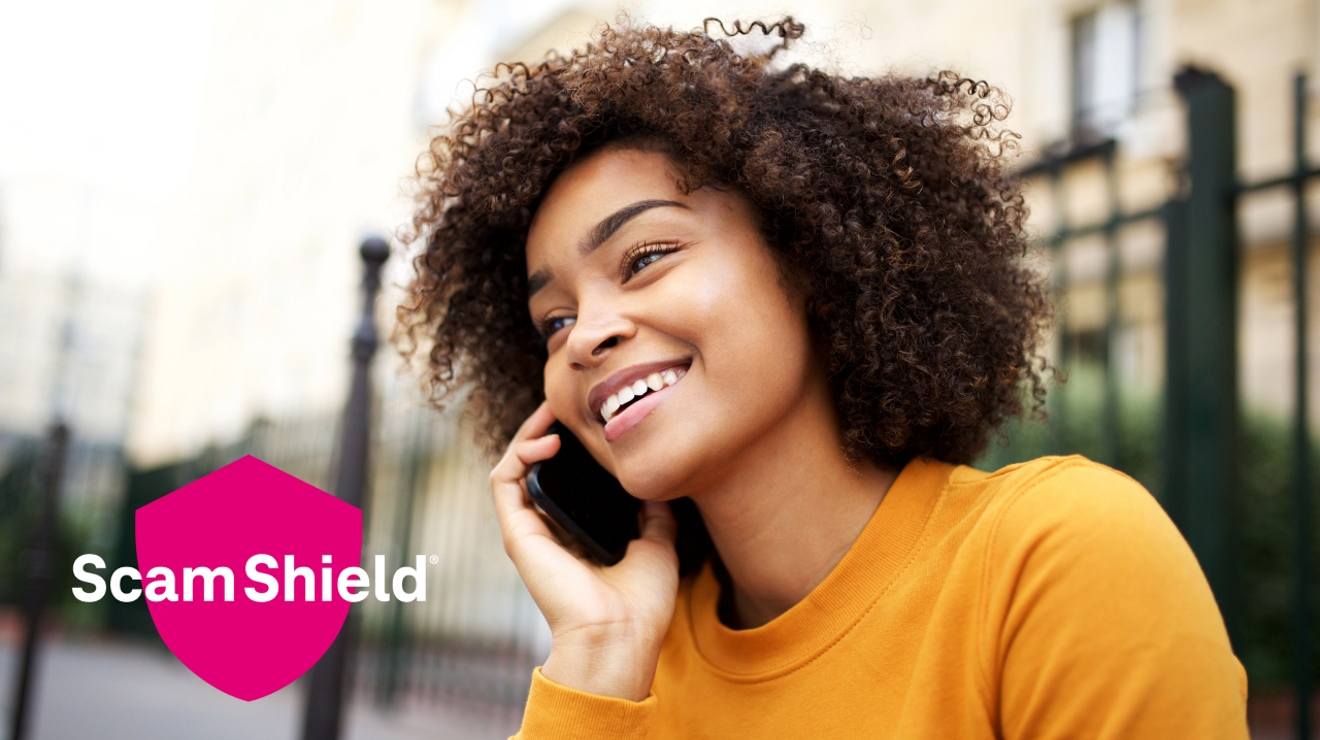 Woman speaking on phone with “Scam Shield®” in a magenta shield displayed.