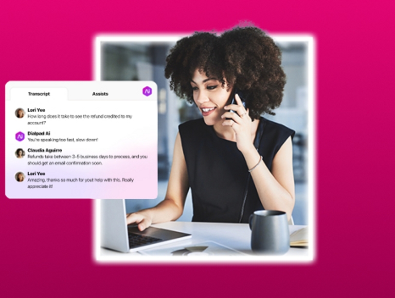 Dialpad Ai assists a professional while she works on her laptop and speaks on the phone.