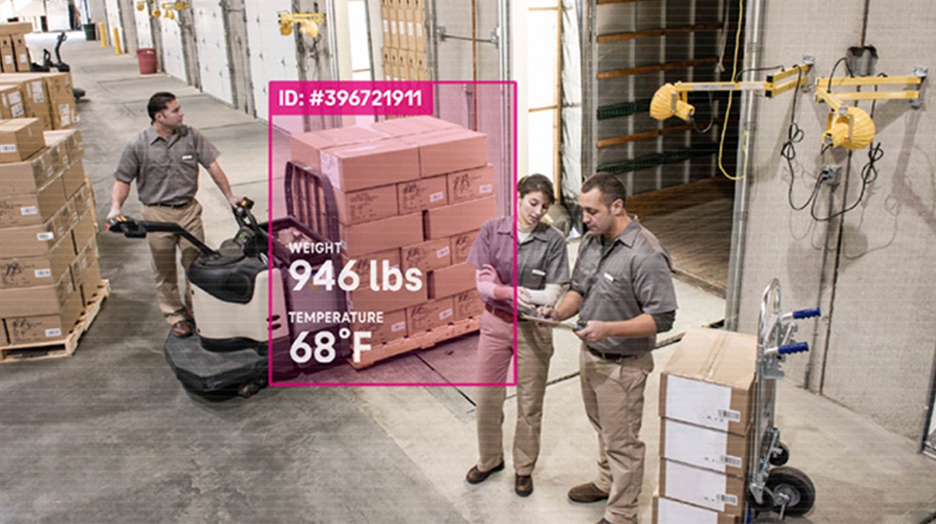 Camera feed of warehouse and workers has data on boxes superimposed over image