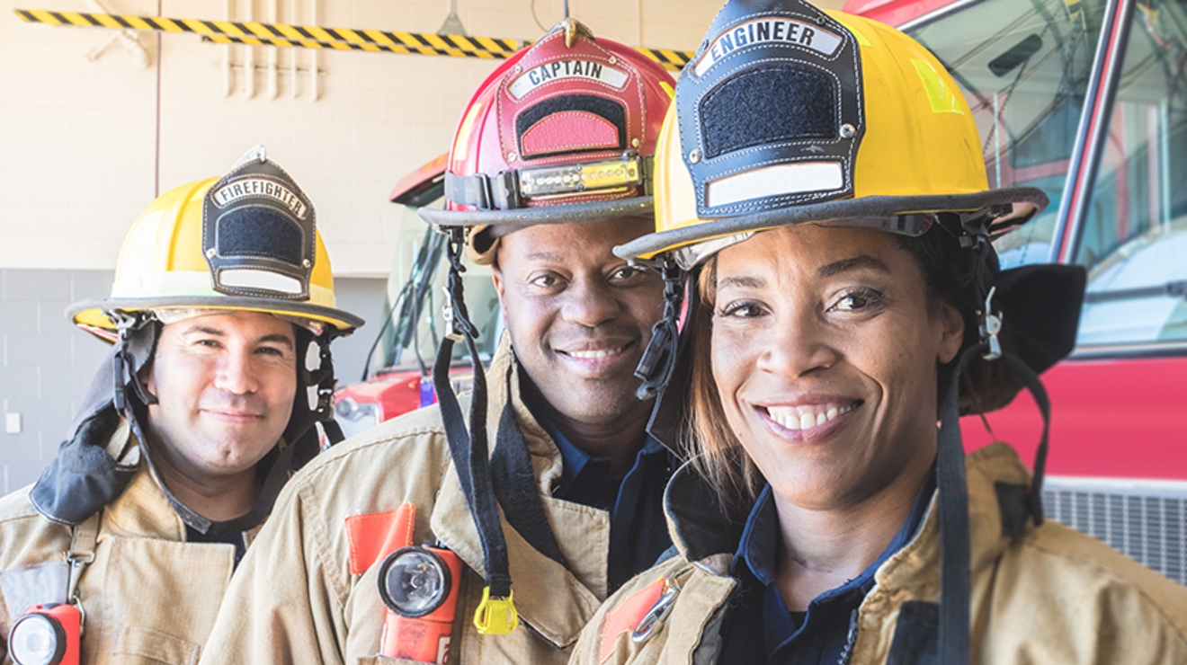 Three firefighters smiling