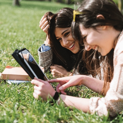 Two girls on the grass.