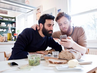 A couple looking at a phone together.