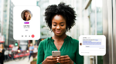 Professional on a city street uses Dialpad on her smartphone to quickly reach a colleague and get the link to a file she needs.