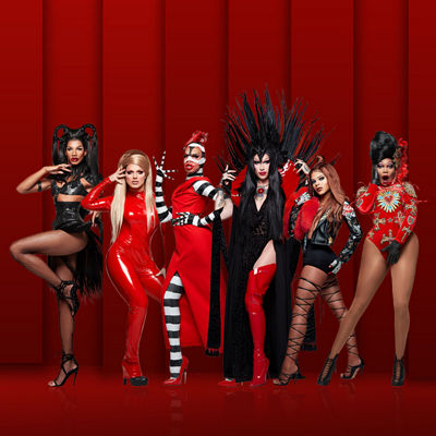 Various participants of Ru Paul’s Drag Race pose for the camera In black, white, and red costumes.